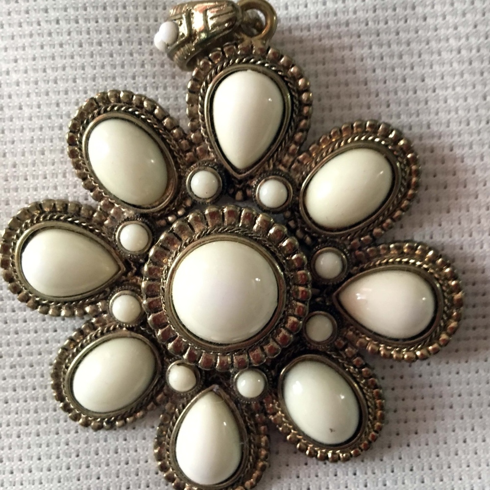 Pendant of white enamel and antiqued gold tone